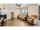 Well-lit living room with a cozy seating area and views of the outside at 8953 Falcon St, Firestone, CO 80504