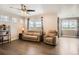 Spacious living room featuring comfortable seating and large windows at 8953 Falcon St, Firestone, CO 80504