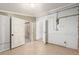 Unfinished basement with doorway and tile floor at 1151 Revere St, Aurora, CO 80011