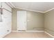 Unfinished basement with door and painted walls at 1151 Revere St, Aurora, CO 80011