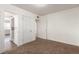 Neutral bedroom with neutral carpet, white trim, multiple doors, and lots of natural light at 1151 Revere St, Aurora, CO 80011