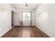 Hardwood bedroom with bright, natural light featuring some wall decor at 1151 Revere St, Aurora, CO 80011