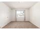Neutral bedroom features a large window, carpet flooring, and neutral decor at 1151 Revere St, Aurora, CO 80011