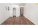 Bright bedroom with wooden floors, closet, and two doorways for access to other rooms at 1151 Revere St, Aurora, CO 80011