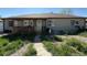 Charming single-story home with a covered porch and mature landscaping at 1151 Revere St, Aurora, CO 80011