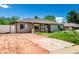 Inviting single-story house with a covered front porch and a driveway and front yard area needing attention at 1151 Revere St, Aurora, CO 80011