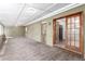 Enclosed sunroom with view to kitchen and backyard at 1151 Revere St, Aurora, CO 80011