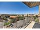 Balcony view of nearby low rise buildings, landscaping and parking with a clear blue sky overhead at 9079 E Panorama Cir # 419, Englewood, CO 80112