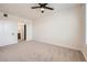 A spacious bedroom features a large window, neutral walls, and plush carpeting at 9079 E Panorama Cir # 419, Englewood, CO 80112