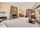 Inviting common area featuring a fireplace, comfortable seating, and ample natural light at 9079 E Panorama Cir # 419, Englewood, CO 80112