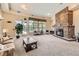 Comfortable common area with a fireplace, furniture, and an exit to the pool at 9079 E Panorama Cir # 419, Englewood, CO 80112