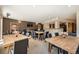 Dining room with tables, chairs, decorative plants and view of the kitchen area at 9079 E Panorama Cir # 419, Englewood, CO 80112