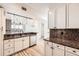 Bright kitchen with stainless steel dishwasher and sink overlooking the living area at 9079 E Panorama Cir # 419, Englewood, CO 80112