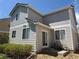 Gray two-story home featuring back patio, slider, and landscaped yard at 1160 S Fultondale Ct, Aurora, CO 80018