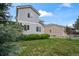 View of the home's well-maintained backyard and attractive exterior from a ground-level perspective at 1160 S Fultondale Ct, Aurora, CO 80018