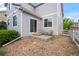 View of the backyard patio with seating and a sliding door, showing the exterior and landscaping at 1160 S Fultondale Ct, Aurora, CO 80018