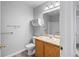 Neat bathroom featuring a vanity, toilet, shelving, and a shower-tub combination at 1160 S Fultondale Ct, Aurora, CO 80018