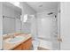 Clean bathroom features a vanity, toilet and shower-tub combination with shower curtain at 1160 S Fultondale Ct, Aurora, CO 80018
