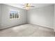 Spacious bedroom featuring a window providing natural light and plush carpeting at 1160 S Fultondale Ct, Aurora, CO 80018