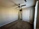 Bedroom with carpeted floors, a ceiling fan, and a spacious closet at 1160 S Fultondale Ct, Aurora, CO 80018