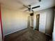 Cozy bedroom features carpeted floors, updated fan, and a closet at 1160 S Fultondale Ct, Aurora, CO 80018
