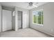 Bright bedroom featuring a ceiling fan and natural light from a large window at 1160 S Fultondale Ct, Aurora, CO 80018
