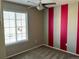 Bright bedroom with carpet, ceiling fan and a striped accent wall at 1160 S Fultondale Ct, Aurora, CO 80018