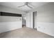 Well-lit bedroom showcasing closet space, neutral carpet, and stylish wainscoting at 1160 S Fultondale Ct, Aurora, CO 80018