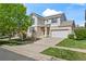 Charming two-story home with brick accents, a well-manicured lawn, and a two-car garage at 1160 S Fultondale Ct, Aurora, CO 80018