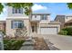 Attractive two-story home with brick accents, an attached two-car garage and landscaped front yard at 1160 S Fultondale Ct, Aurora, CO 80018