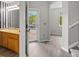 Spacious foyer with views to a half bath, light gray walls, laminate floors, and lots of natural light at 1160 S Fultondale Ct, Aurora, CO 80018