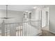 Open hallway area with a white railing overlooking the lower level of the home at 1160 S Fultondale Ct, Aurora, CO 80018