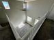 Hallway and open floorplan with views to living room below and natural light at 1160 S Fultondale Ct, Aurora, CO 80018