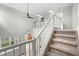 Hallway with stairs showcasing the open floor plan and easy access to the upper levels at 1160 S Fultondale Ct, Aurora, CO 80018