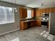 Traditional kitchen features wood cabinets, stainless steel appliances, and lots of natural light at 1160 S Fultondale Ct, Aurora, CO 80018