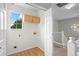 Functional laundry room with overhead cabinets and utility connections at 1160 S Fultondale Ct, Aurora, CO 80018