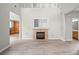 Spacious living room featuring a cozy fireplace and built-in shelving, perfect for relaxation at 1160 S Fultondale Ct, Aurora, CO 80018
