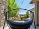 Back patio features a porch swing and flower boxes overlooking the yard at 6995 S Ensenada St, Aurora, CO 80016
