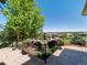 Inviting backyard view showcasing lovely landscaping with wooden flower box and a stunning vista at 6995 S Ensenada St, Aurora, CO 80016