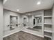The mirrored basement studio features wood laminate flooring and recessed lighting at 6995 S Ensenada St, Aurora, CO 80016