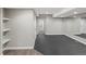 Finished basement area featuring carpet and luxury vinyl floors and a full wall mirror at 6995 S Ensenada St, Aurora, CO 80016