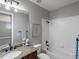 Bathroom featuring tub-shower combo, and granite topped vanity at 6995 S Ensenada St, Aurora, CO 80016