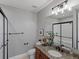 Bathroom with granite counters and shower at 6995 S Ensenada St, Aurora, CO 80016