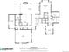 Main level floor plan showcases a large kitchen, living room, primary bedroom, and a three-car garage at 6995 S Ensenada St, Aurora, CO 80016