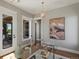 Bright office features a modern chandelier, lots of light and stylish decor at 6995 S Ensenada St, Aurora, CO 80016