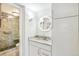 Modern bathroom features a vanity with a lighted mirror and marble countertop at 1255 N Ogden St # 605, Denver, CO 80218