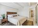 Relaxing bedroom featuring a comfortable bed and vintage design elements at 1255 N Ogden St # 605, Denver, CO 80218