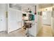Stylish kitchenette with white cabinets, stainless steel appliances, and a breakfast bar at 1255 N Ogden St # 605, Denver, CO 80218