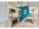 Close-up of the kitchenette featuring stainless steel appliances, granite countertops, and modern fixtures at 1255 N Ogden St # 605, Denver, CO 80218