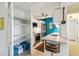 Functional kitchenette with pantry storage, modern appliances, and a breakfast bar at 1255 N Ogden St # 605, Denver, CO 80218